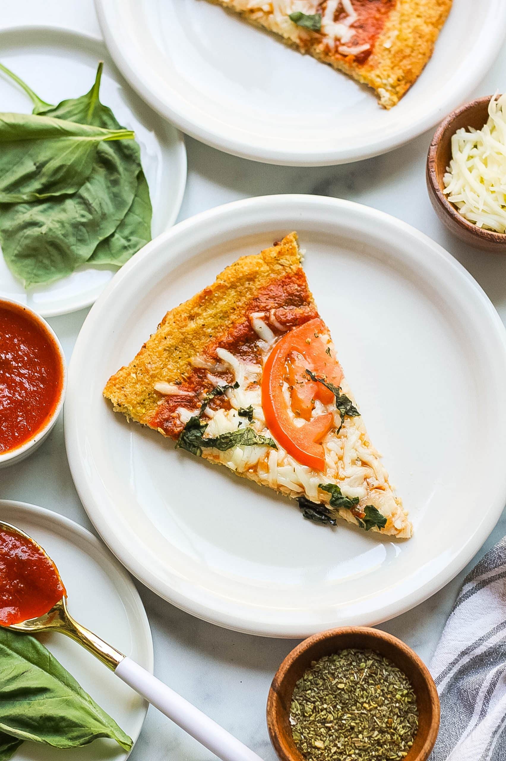 slice of cauliflower pizza crust with toppings