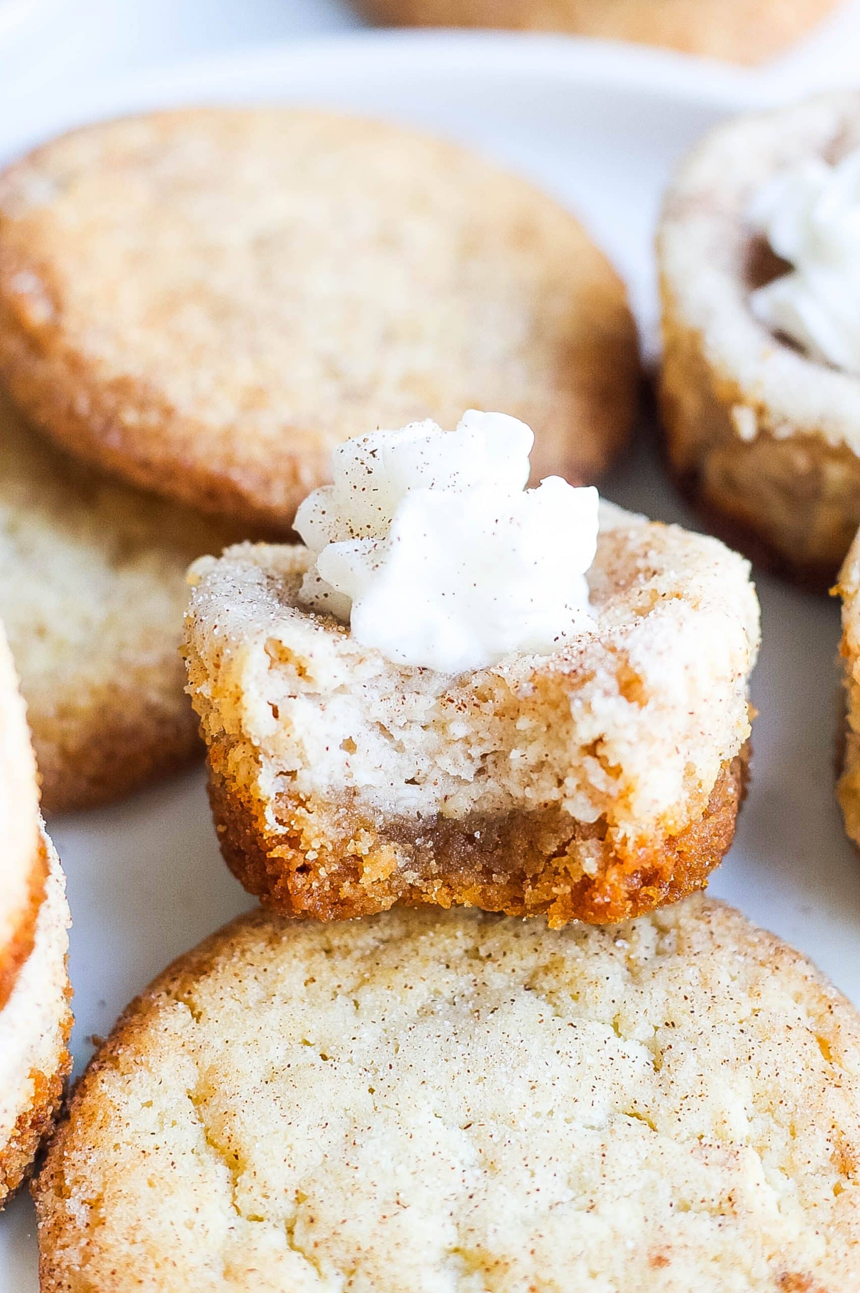 close view of cheesecake bite with whipped cream