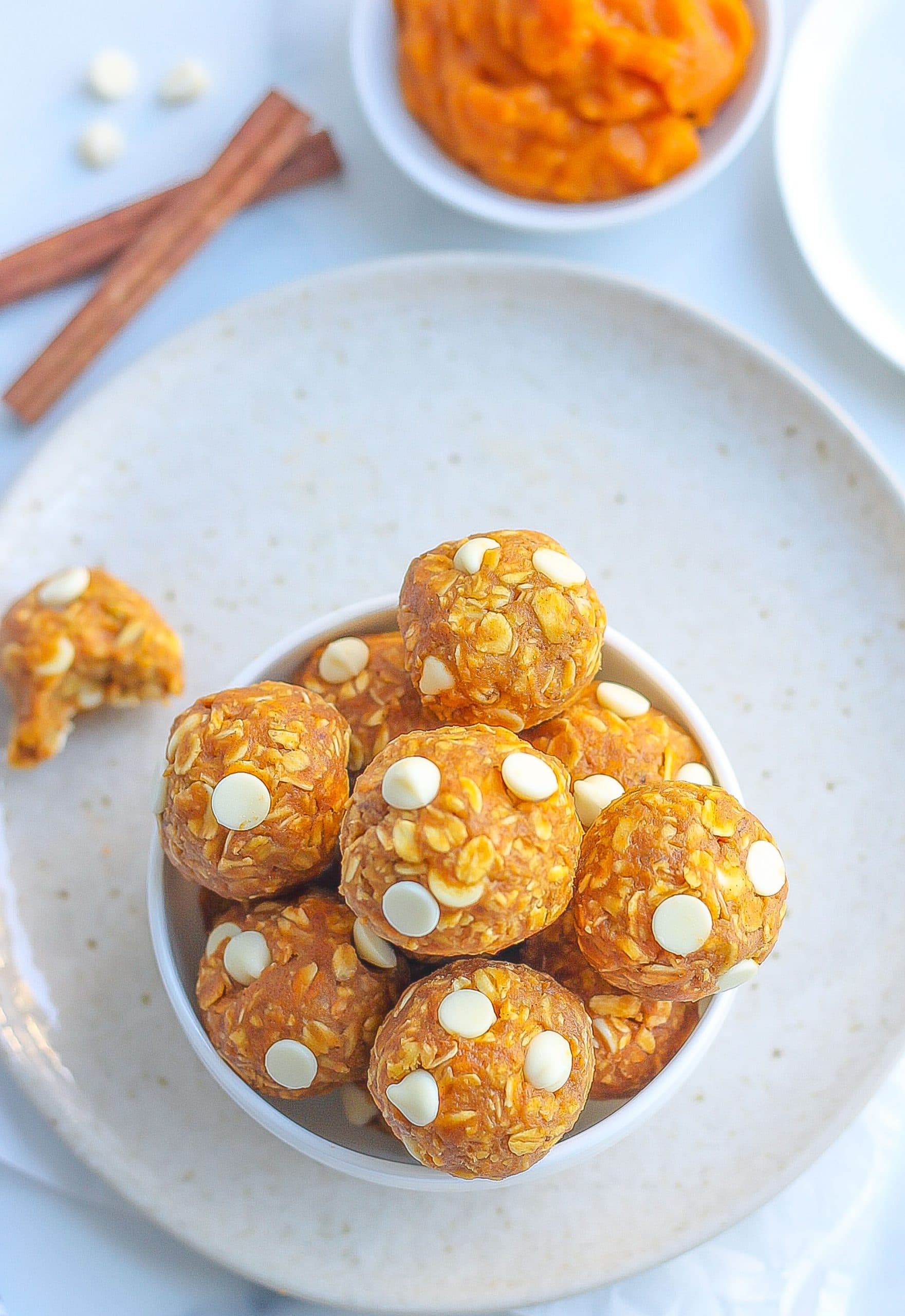 top view of pumpkin energy bites in white bowl 